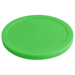 A green frisbee is sitting on top of a white surface.