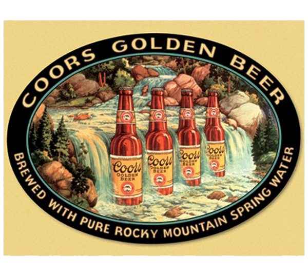 A sign advertising coors golden beer in the mountains.