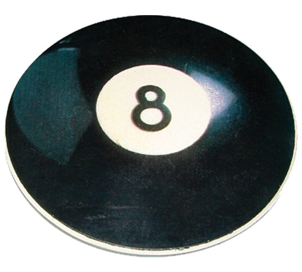 A black and white eight ball sitting on top of a table.