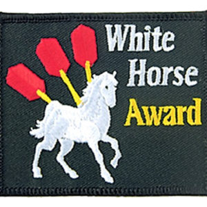 A patch that says white horse award with three red darts.