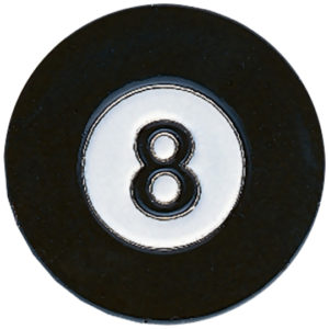 A black and white eight ball sitting on top of a table.