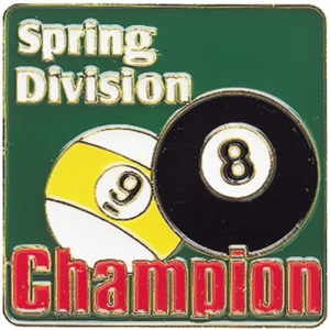 A pin with the words spring division and champion on it.