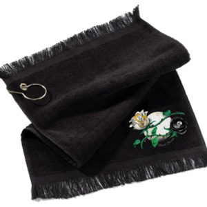 A black towel with a flower and a key chain.