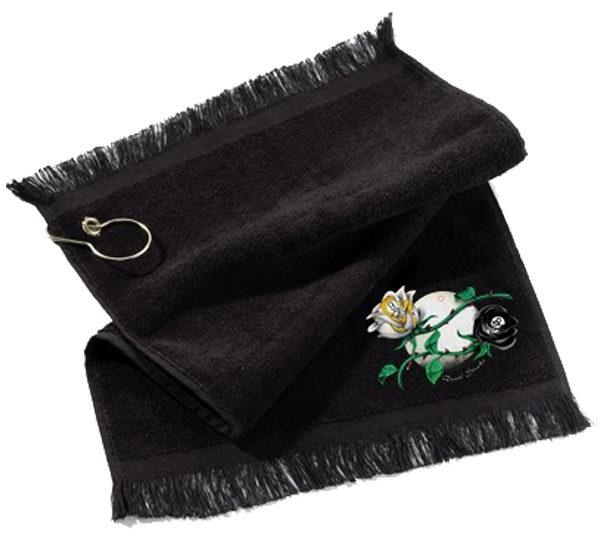 A black towel with a flower and a key chain.